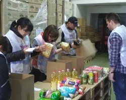 Sort out donated food for people in need in April